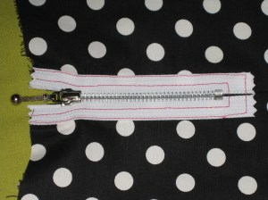 Reverse of exposed zip. By keeping the full width of the seam allowance, there will be no chance of the harsh metal teeth rubbing skin.