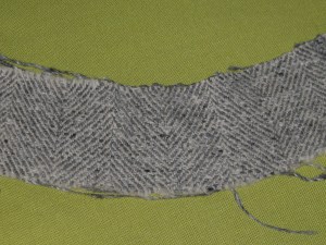 Upper edge shrunk into a curve; lower edge stretched into a curve.