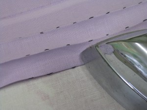 Press tucks from right side using thread marks as a guide to the fold line