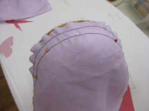 Place sleeve cap over small end of the ham and pin in place with glass head pins. Keep the pins on the seam line.