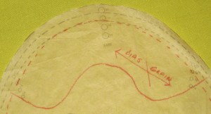 Mark cutting lines for sleeve head on sleeve pattern; trace off and cut from thin wadding/batting.  Bias grain helps the sleeve head mould to the upper arm area.