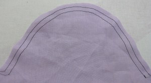 Stitch ease lines while sleeve is flat.  First row on the 15mm seam line and the second row within the seam allowance approximately 6mm away.  Both rows should be parallel and evenly spaced.