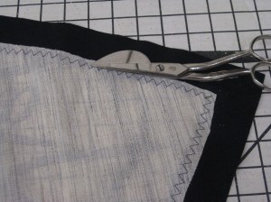 Frame stitched in place and excess hair canvas trimmed away so it will not extend into the sewn seam.
