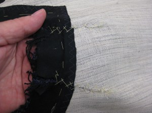 Dart take up fabric removed; hair canvass and fabric edges butted together and catch-stitched in place  over opened fabric dart.