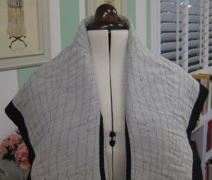 Remaining collar section has been loosely pad-stitched.