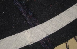 Hair canvass catch-stitched in the hem area of the jacket and sleeves.