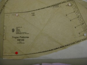 Place pattern piece with folded paper underneath to cut full collar piece