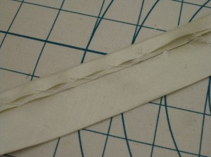 Bottom edge turned under and stitched in place.