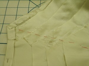 Underside handstitched along each raw edge