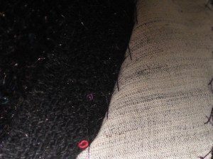 Hem catch stitched half way from hem fold to allow space to machine lining in place