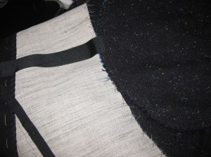 Grosgrain pocket stay runs from front edge of pocket bag across to front edge of jacket.  