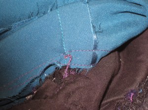 French tacks loosely hold sleeve seams and lining waist seams in place.