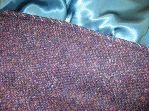 Diagonal basting holds front edges in place for machine topstitching.