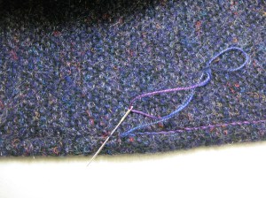 Variegated DMC Cotton Perle 5 thread "wrapped" around each topstitch around edge of upper collar and then reversed for emphasis.
