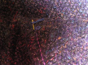 Thread ends buried between layers.