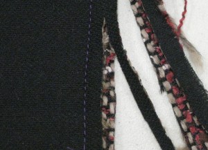 Seam allowance against under collar is cut smaller