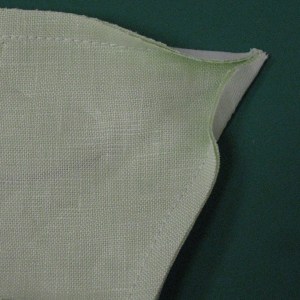 Seam allowances are trimmed so that they meet in the corner with no overlap and no gap