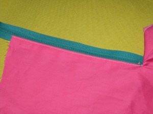 Place right side of zipper against underlap fold - keep teeth close to zipper.