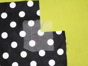Place a small piece of silk organza over the fabric when stay stitching 