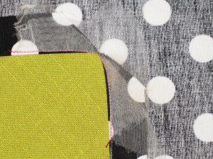 Clip through all layers to reinforced corner. Turn to wrong side and press in place.