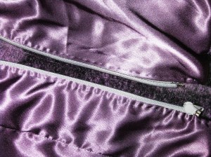 Lining stitched close to underside of teeth and understitched by hand.