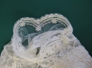 Sleeves were cut unadorned sections of tulle with scalloped border appliqued to the hem. Inserted using hairline seam by machine.