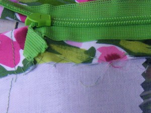 Seam allowance tacked to interfacing and tape folded back and stitched in place.