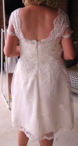 Slight fullness and lower hem to add interest to the back of the gown.