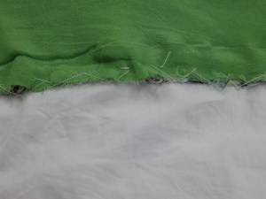 Seam allowances of lining and garment between bodice and underlay stitched together