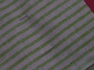 Position fabric with right side of buttonhole fabric to right side of garment.