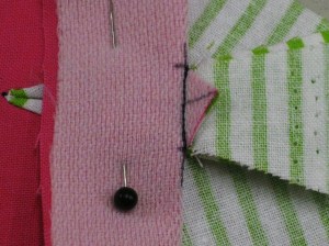 Fold back the base and machine stitch just inside the original stitching.