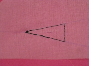 Mark the triangular opening on the wrong side of the garment.