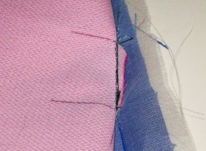 Fold garment back and stitch just inside former stitching lines.