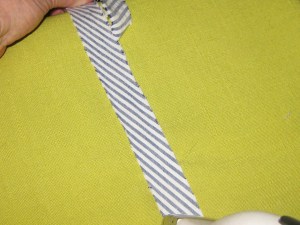 Steam stretch the strip before it is shaped so that it will be less likely to twist once applied. Pull strip away from the iron and steam press.