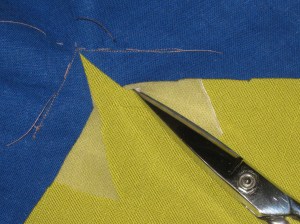 Use small very sharp scissors to clip through both fabric layers to the pivot point.