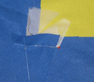 Position fabric pieces with right sides together and the pivot point and seam lines aligned.