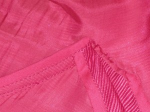Seam allowances pressed open at side seams and away from armhole seam in underarm area.