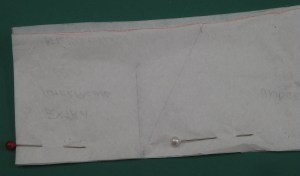 Under collar is approximately 3mm/1/8" narrower in CB and tapers towards front edge at neckline.