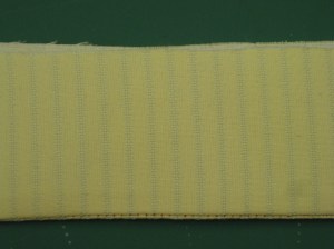 Collar pressed in place and, with under collar uppermost, a small strip of upper collar is visible.