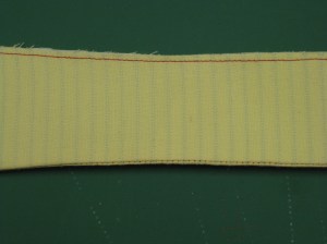 To maintain correct placement when collar is attached to stand, place two bottom edges exactly together and stitch within seam allowance.