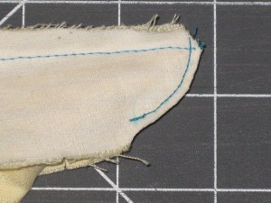 Clip the curved section quite close to stitching - this section may also be notched on thicker fabric. Do not clip the top of the band to CF as this can cause stress of that point when collar is attached.