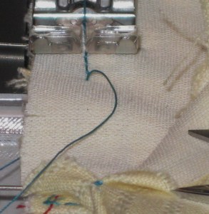 Start stitching with collar stand on top and approximately 3-4cm/1 1/2" from edge. Stitch to opposite end of collar. Turn work and stitch the remainder of seam towards the other end of the collar. This avoids the possibility of stretching the end of the stand when positioning the machine foot.