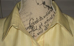 Collar on stand with neckline worn open.