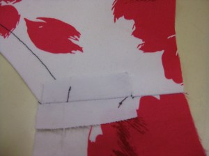 Stitch area which will sit under the facing with wrong sides together; clip and stitch remainder of seam with right sides together.