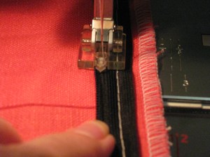 Position teeth inside groove - left hand side in left groove and right hand side in right groove. Sew from top down.