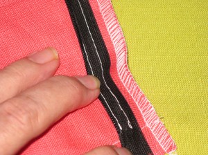 Stitching should be close to the zipper teeth. Move needle a little further from the teeth if fabric is thicker.