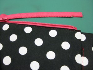 Fold top of tape above coil under and stitch to top