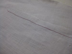Stitch along the hem at 5/8"/15mm from the cut edge.