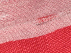 Red mark indicates the bottom of zipper stitching. Grey mark indicates start of stitching to close remaining seam.