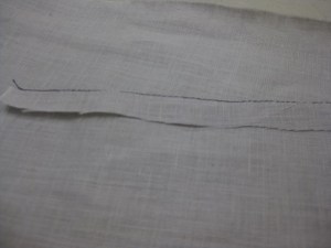 Press up the hem while favouring the stitched line just to the underside.